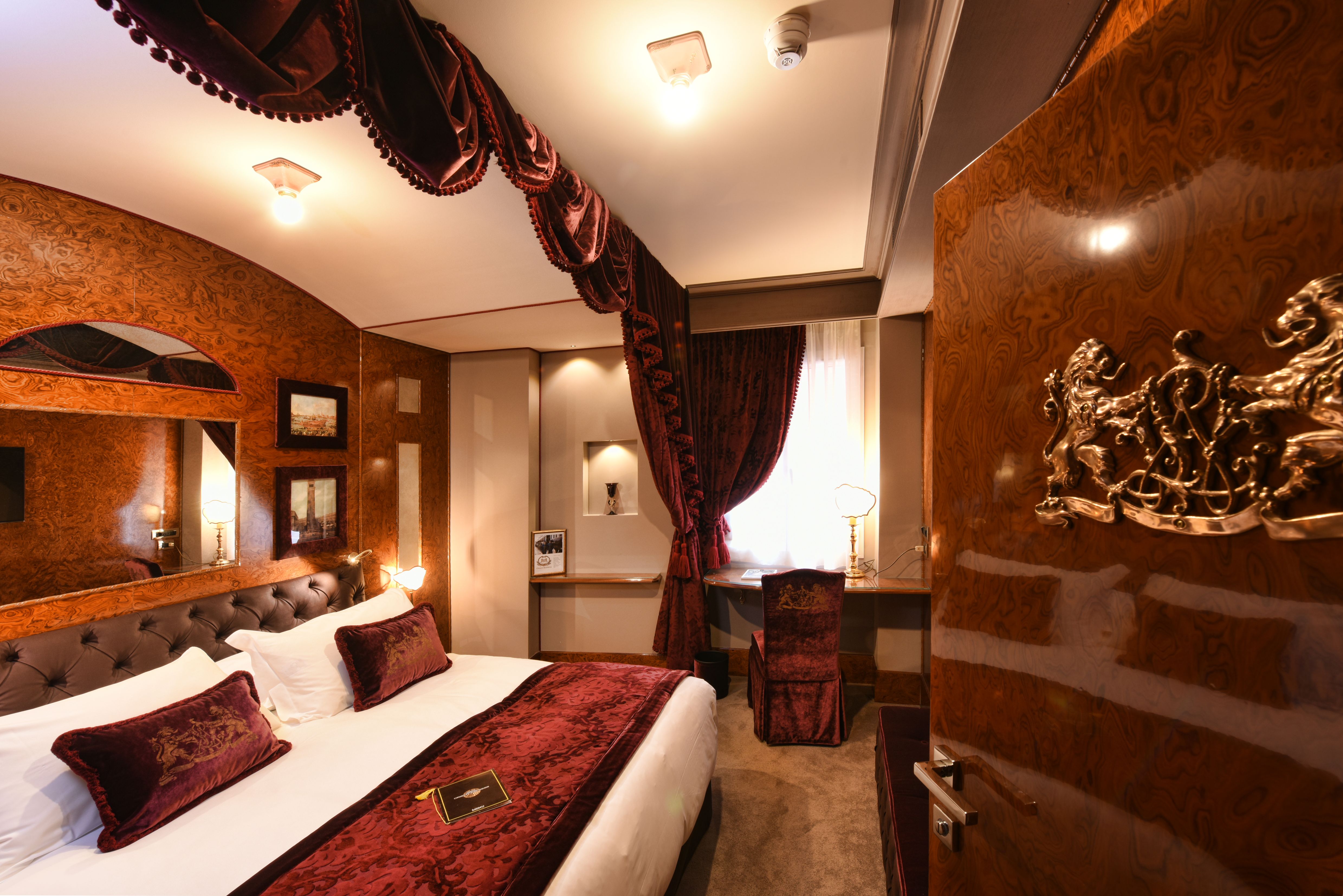 a room with a bed and a desk