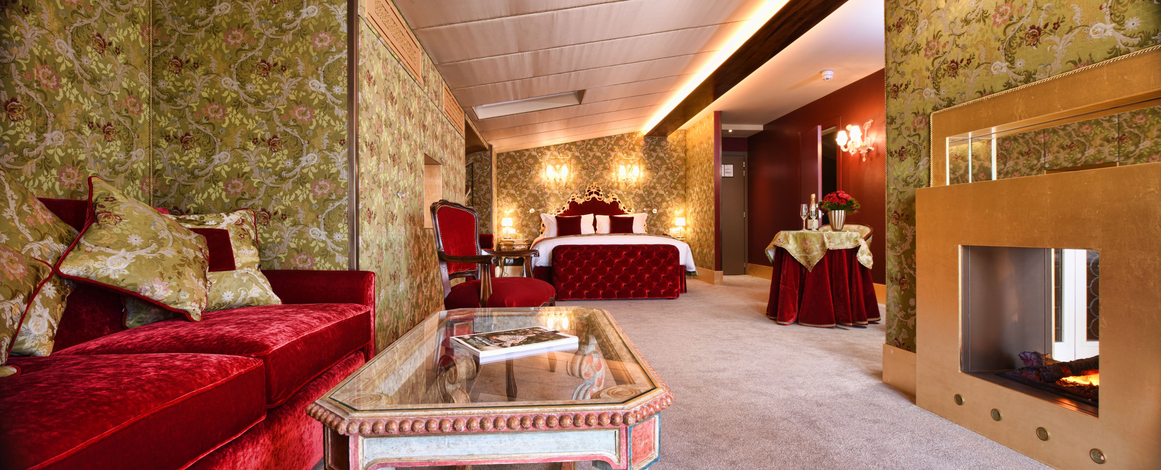 a room with a bed and a glass coffee table
