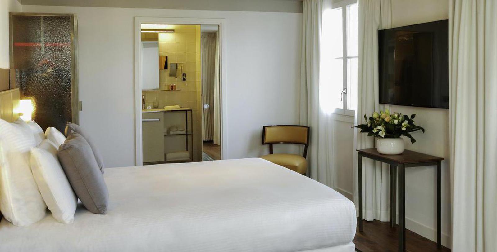 a room with a bed and a chair