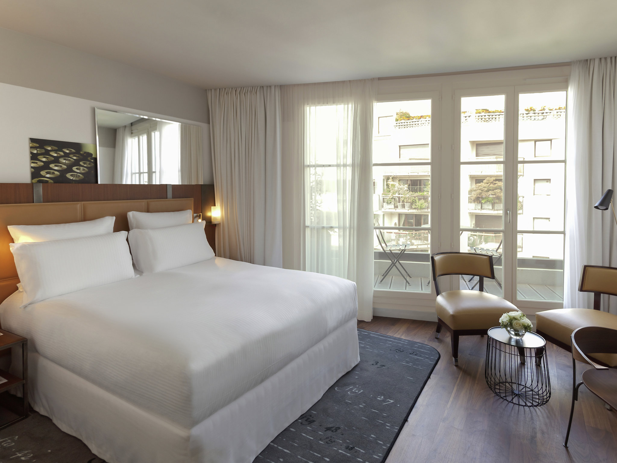 a bedroom with a bed and a chair