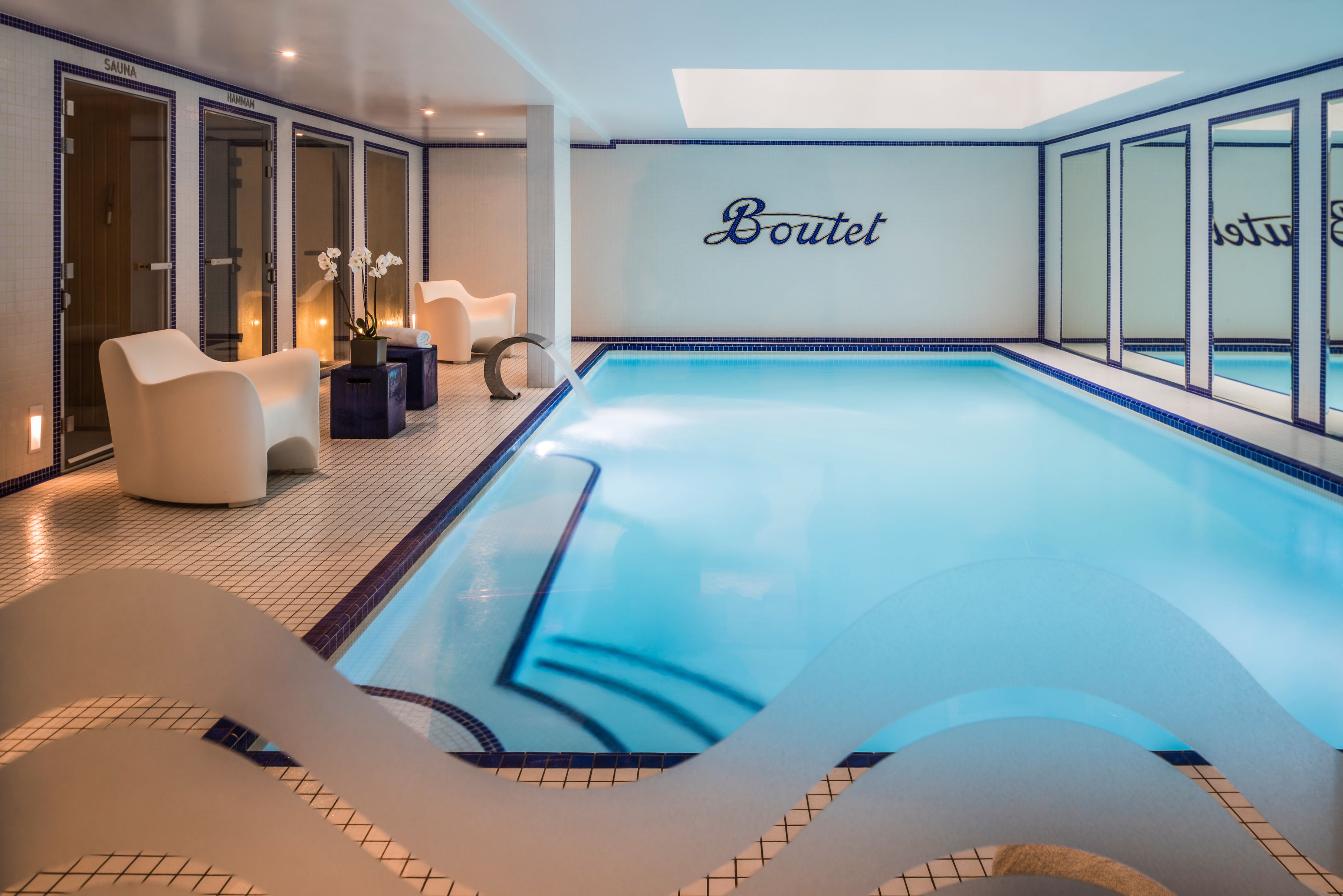 a indoor swimming pool with a slide