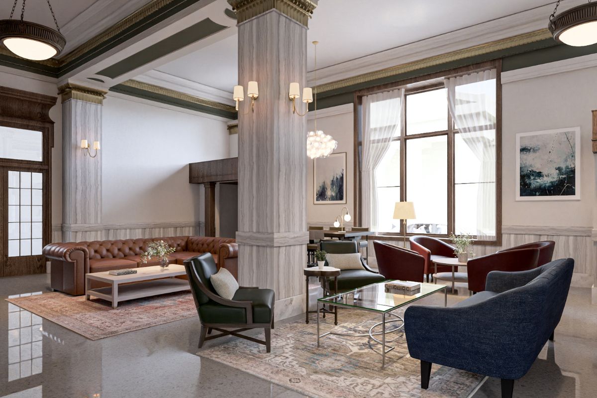 a room with a large column and chairs