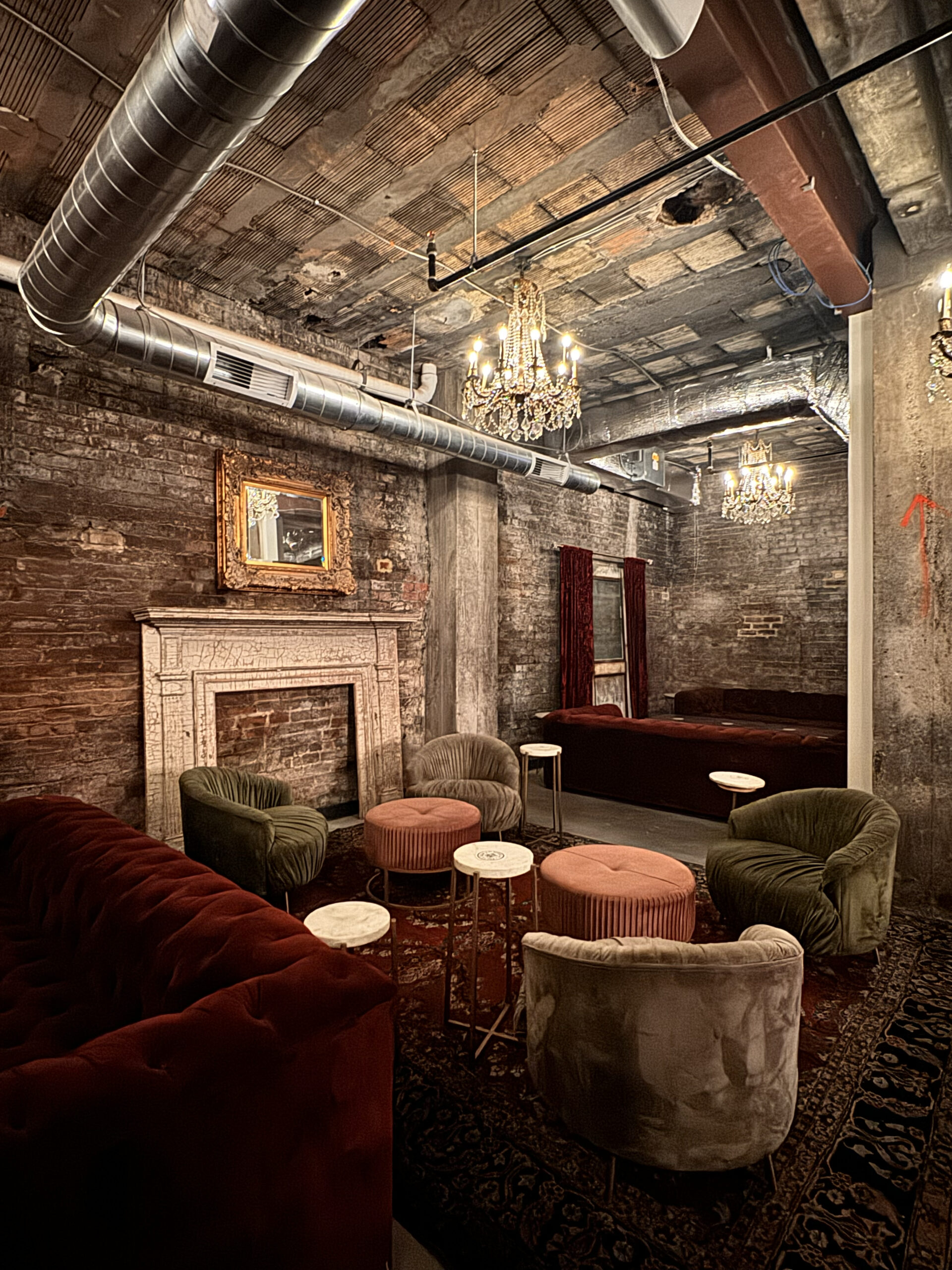 a room with a fireplace and couches