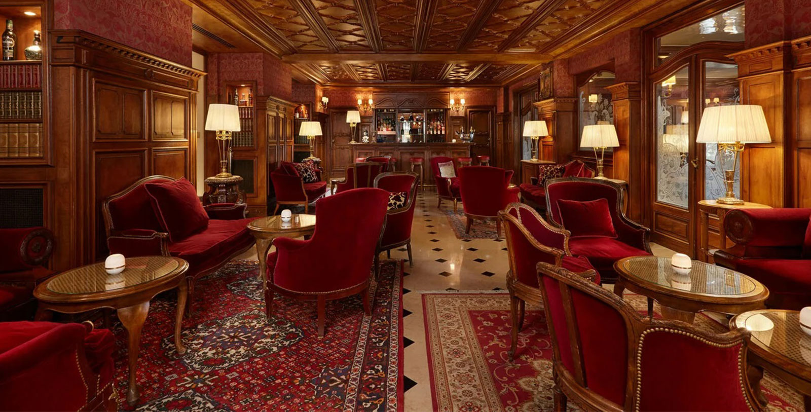 a room with red chairs and a rug
