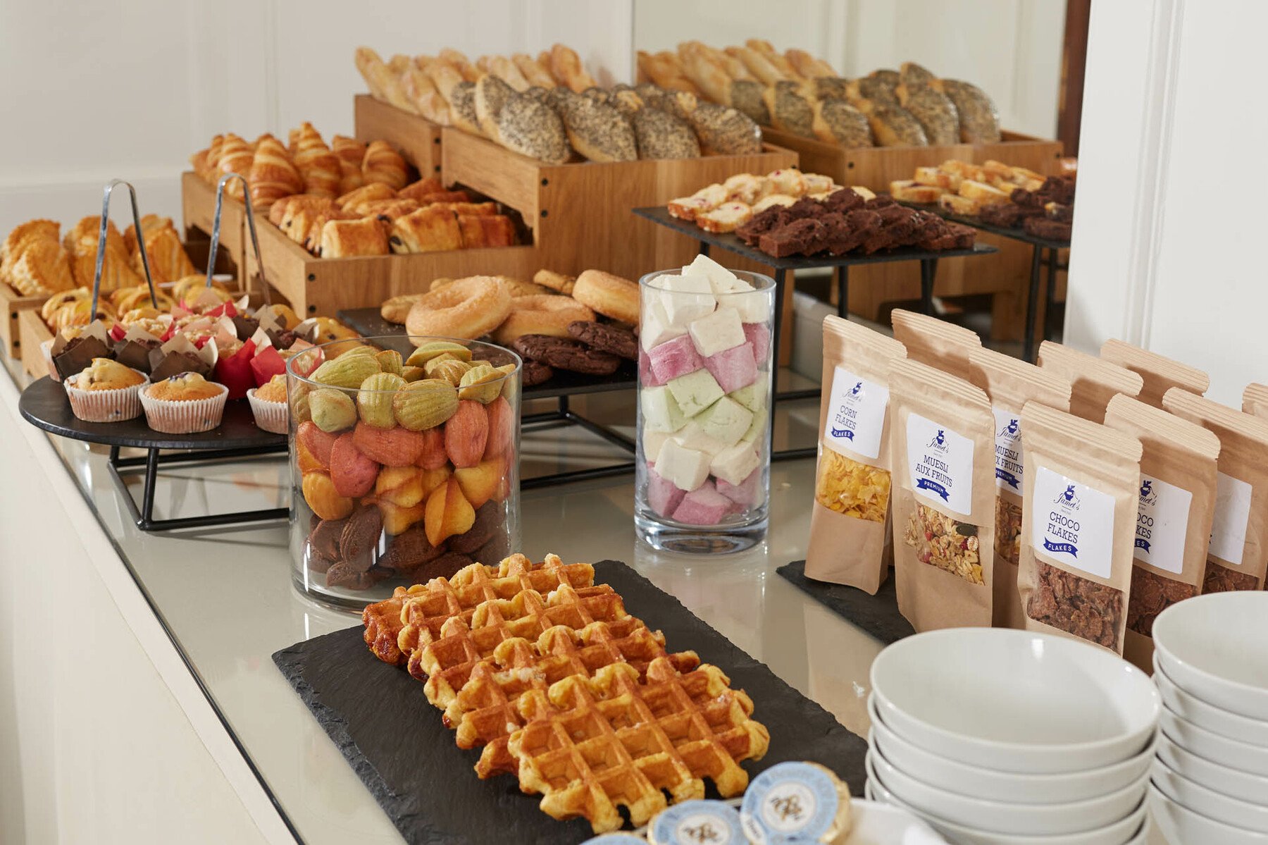 a table with various pastries and pastries