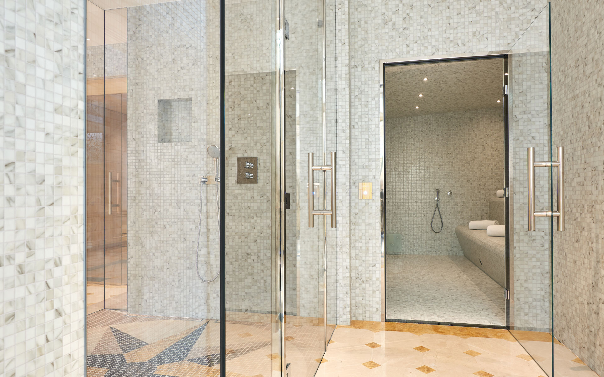 a shower room with a glass door