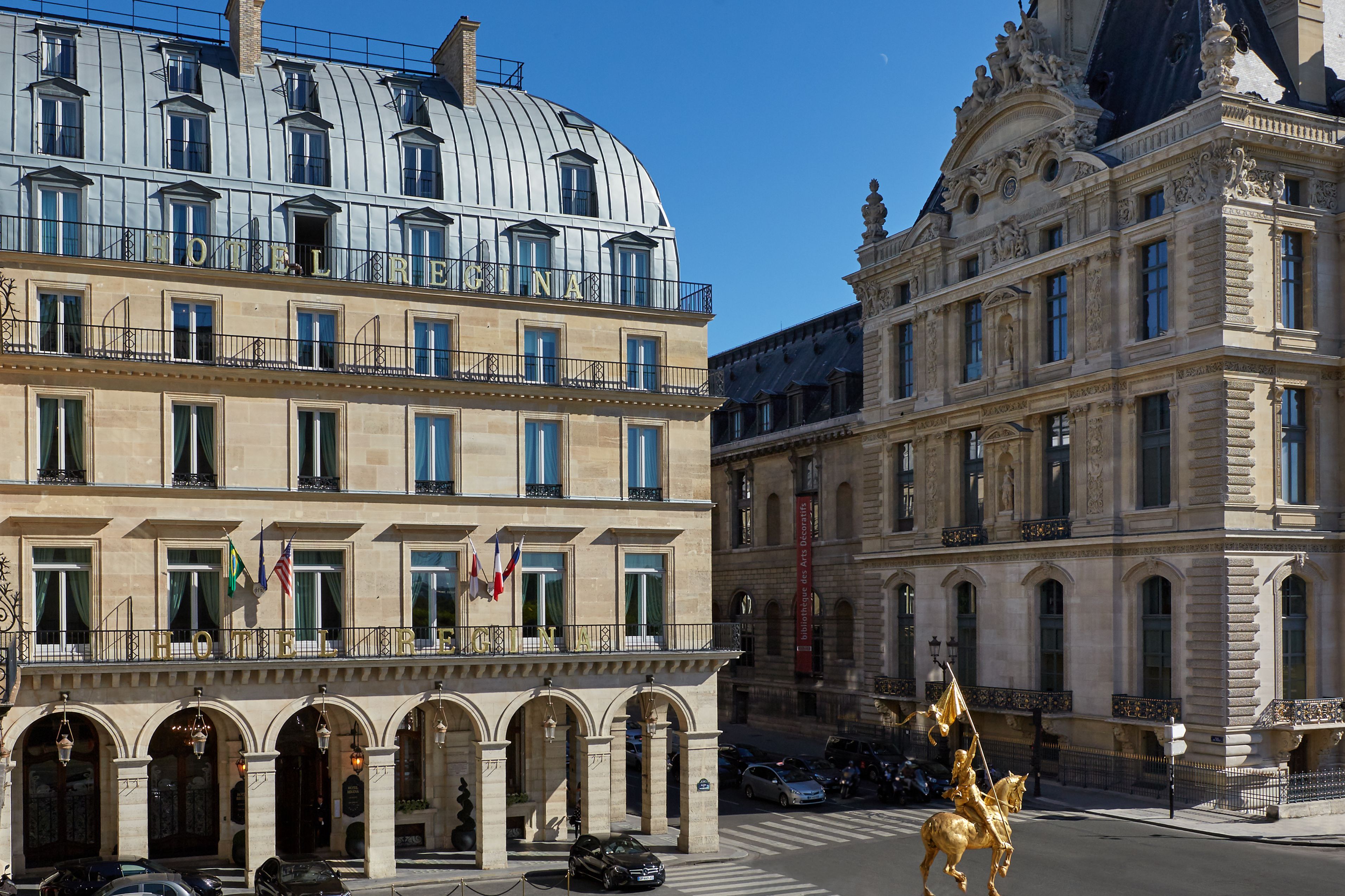 a building with a statue on a horse and a man on a horse