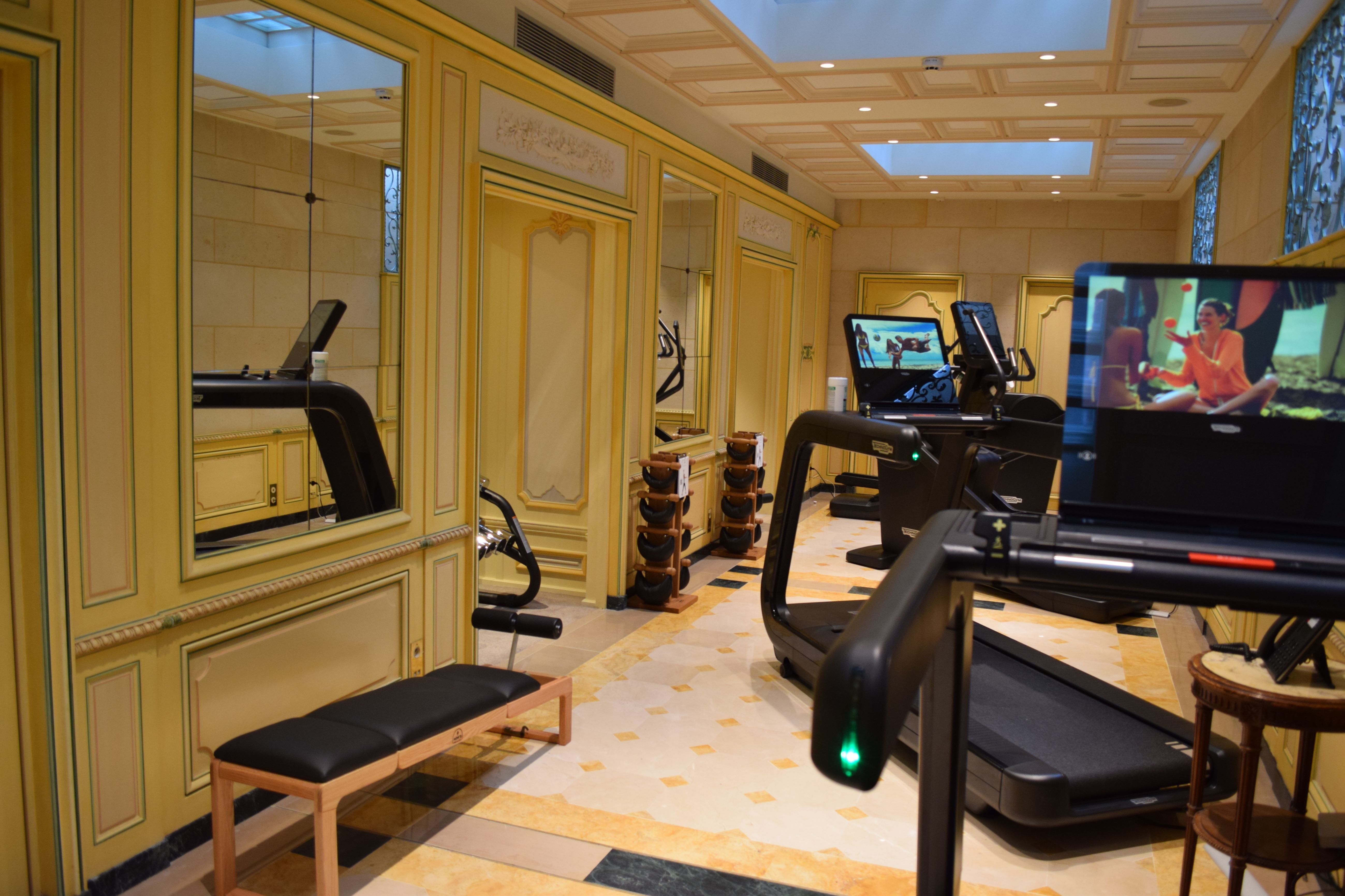 a room with treadmills and mirrors