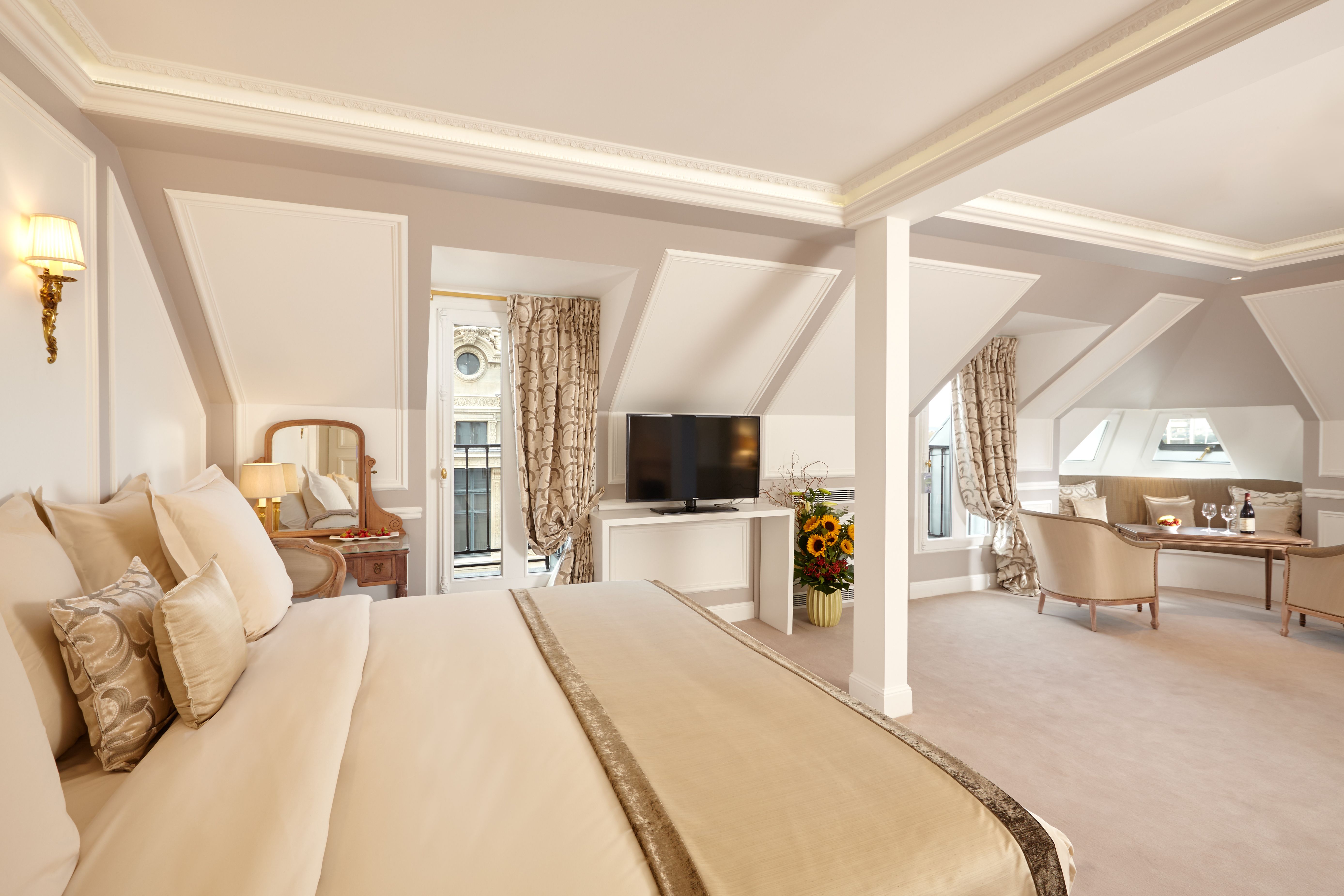 a bedroom with a television and a bed