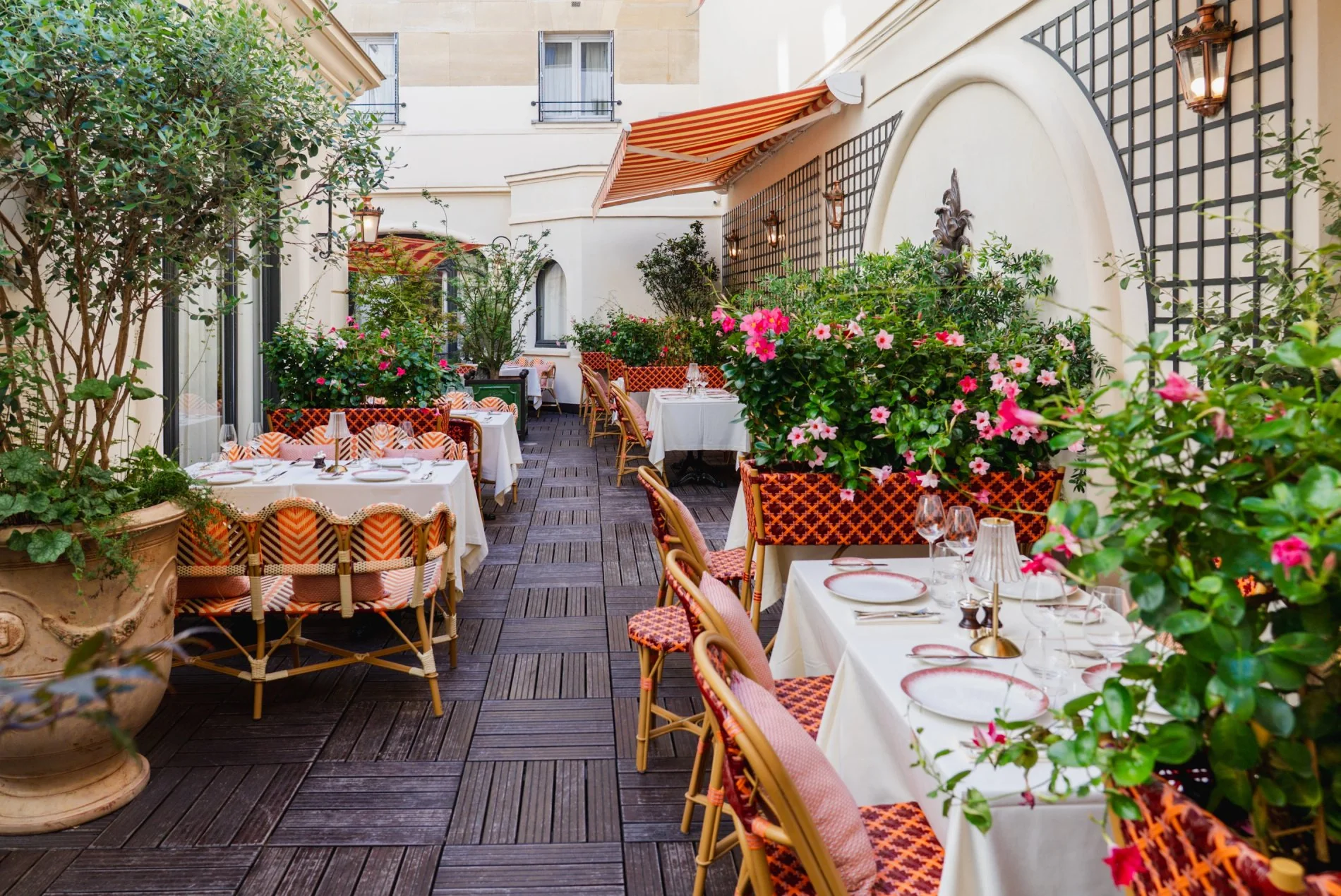 a patio with tables and chairs