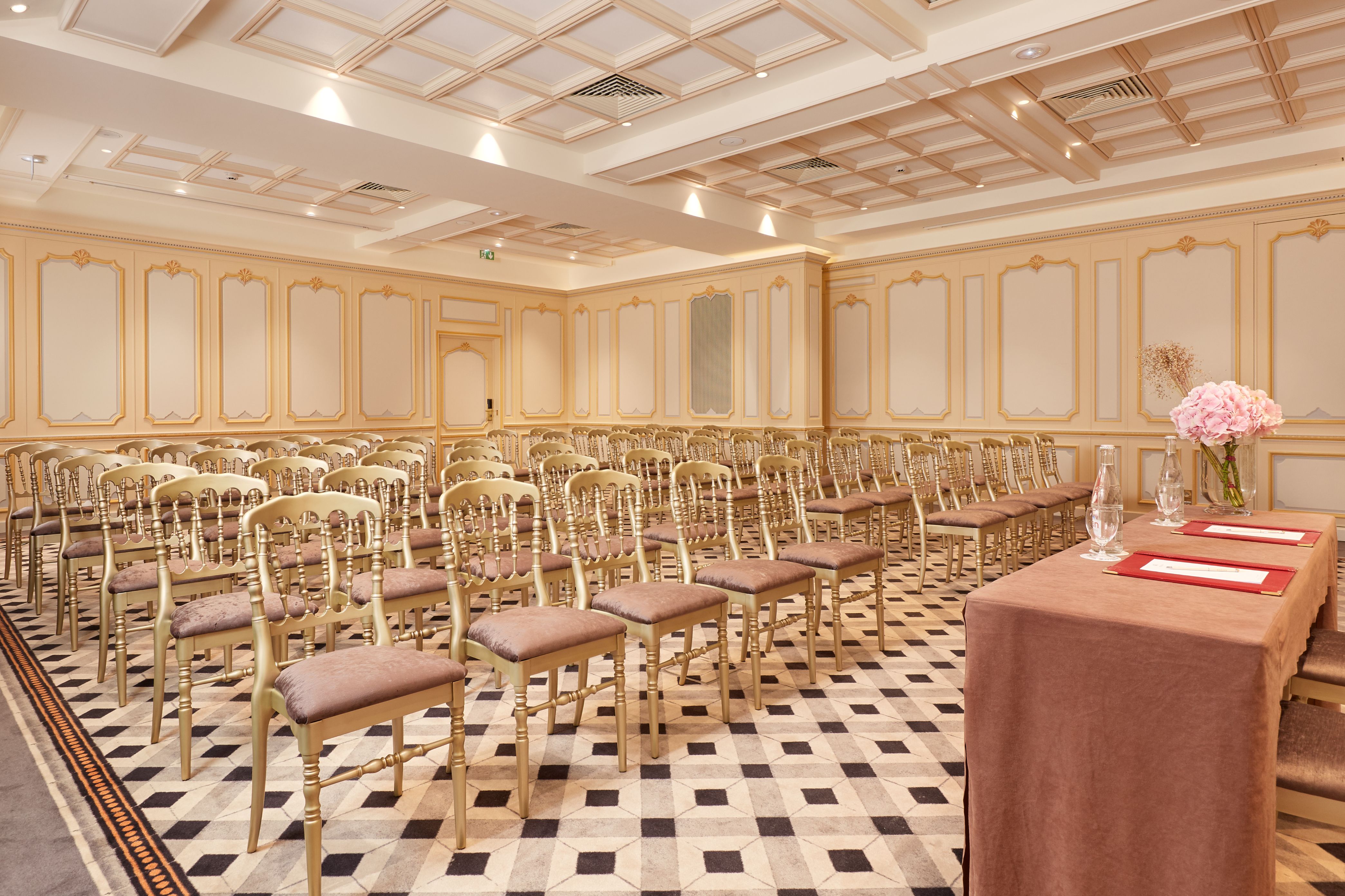 a room with many chairs and a table
