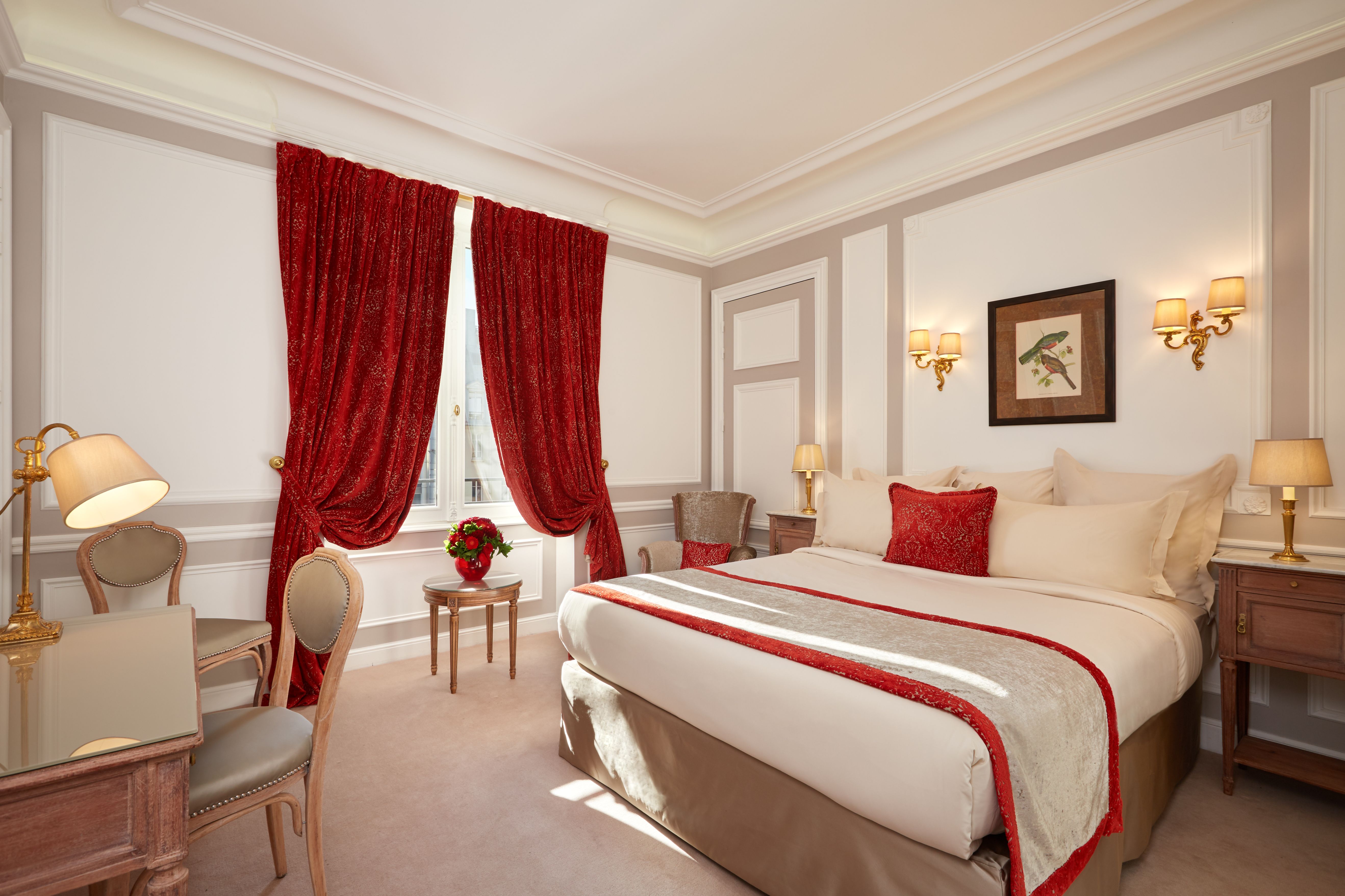 a bedroom with red curtains and a bed