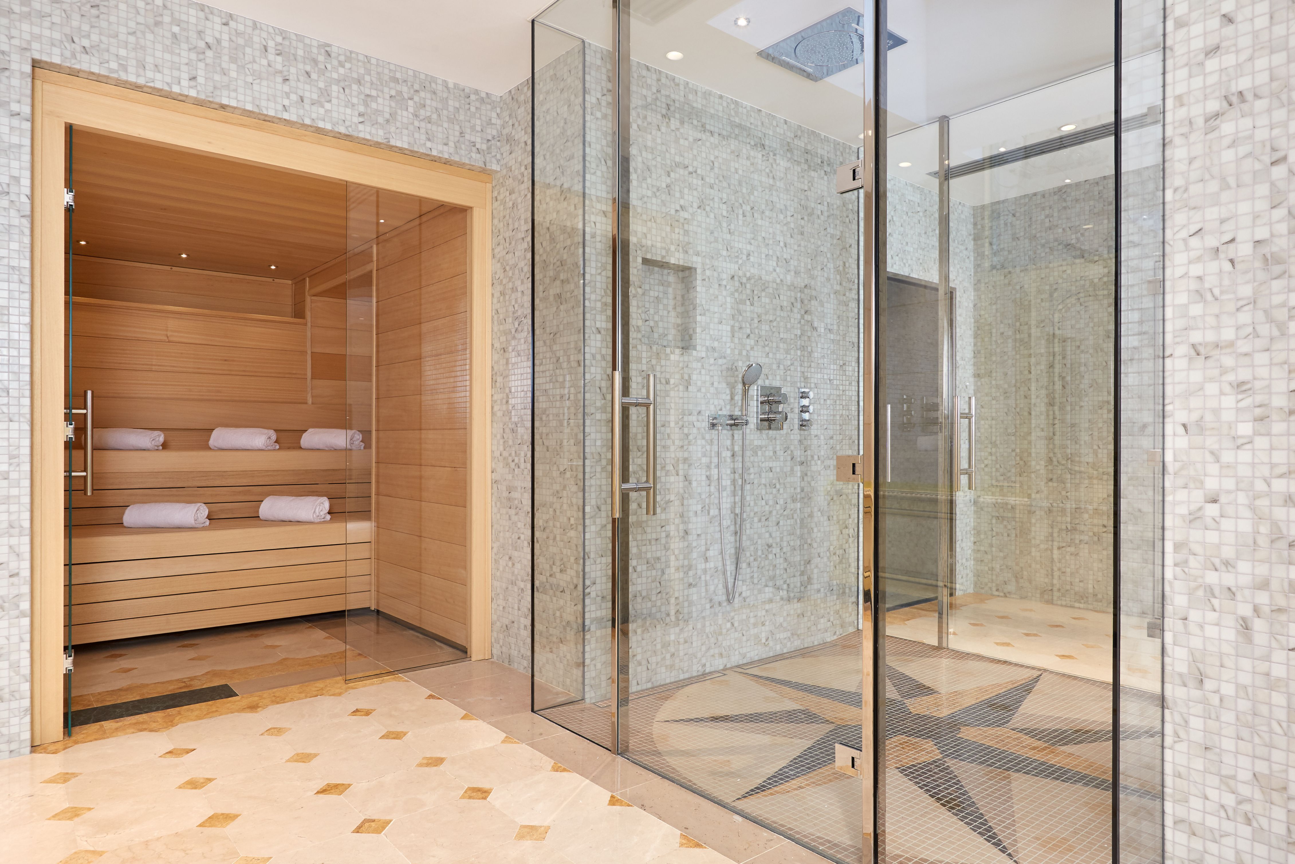 a glass shower and sauna