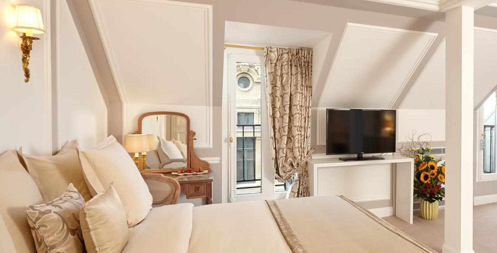 a bedroom with a television and a bed