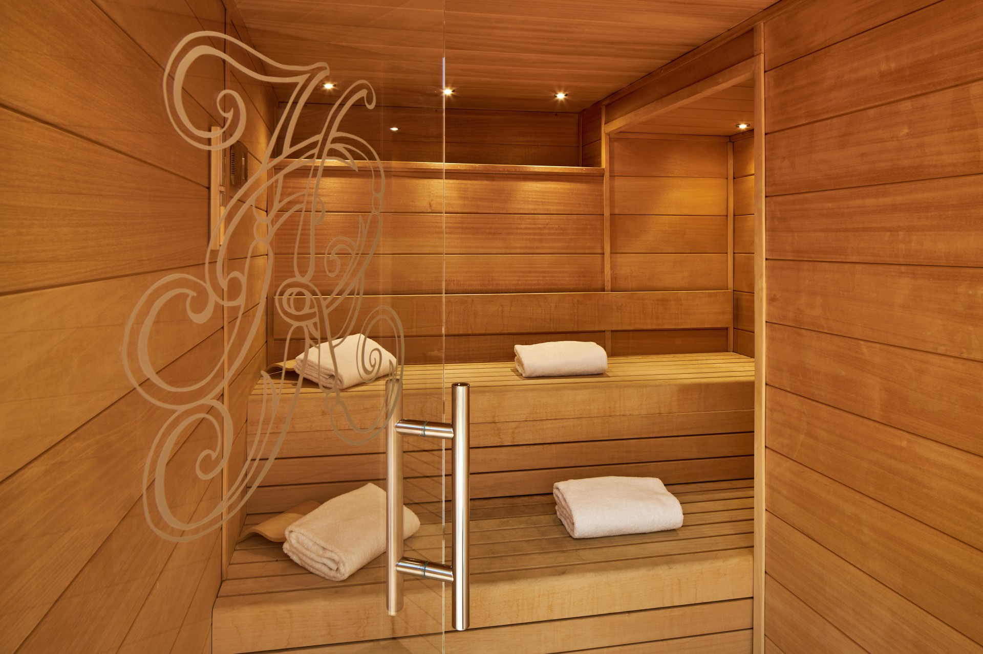 a wooden sauna with towels