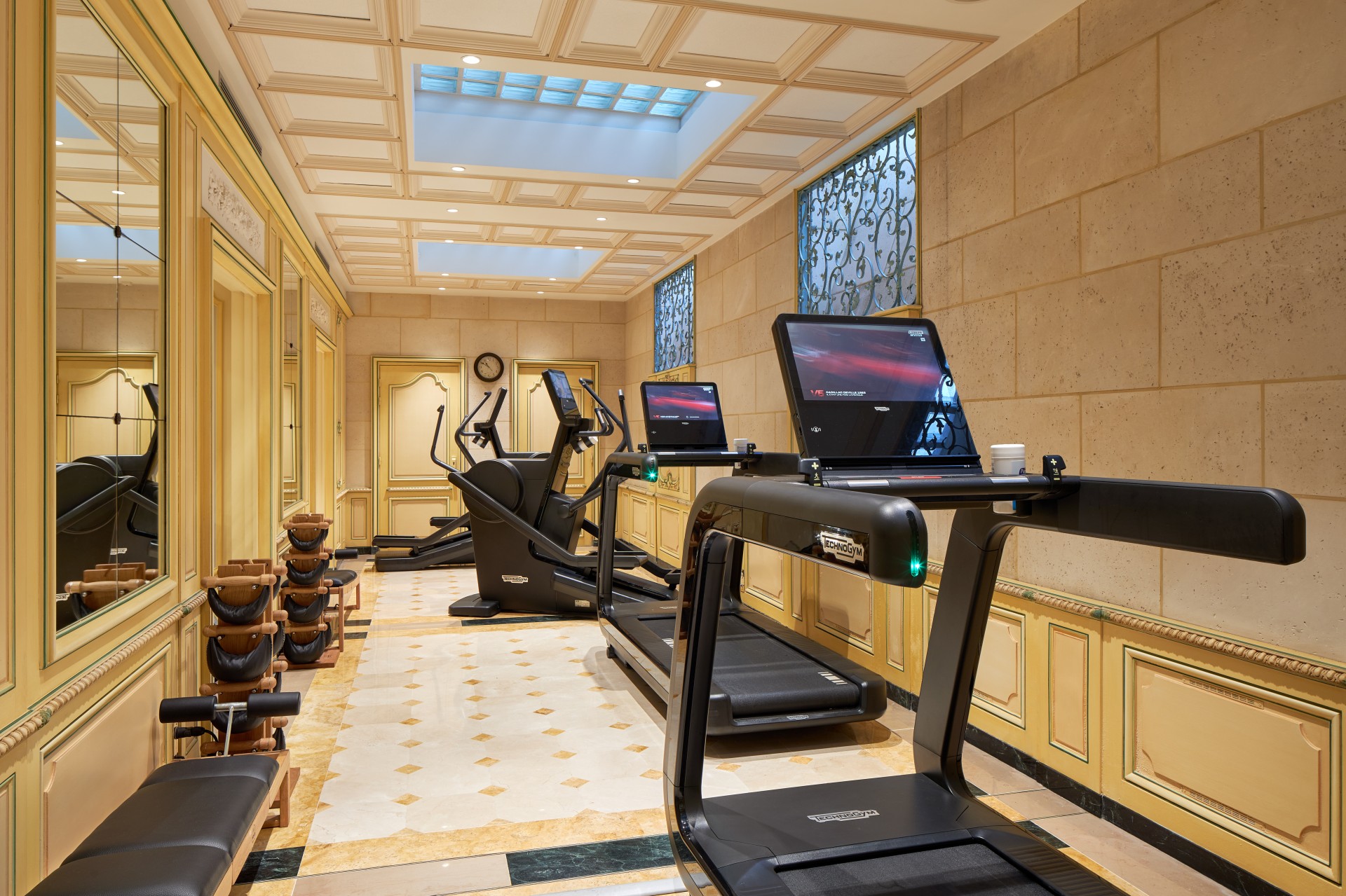 a room with treadmills and computers