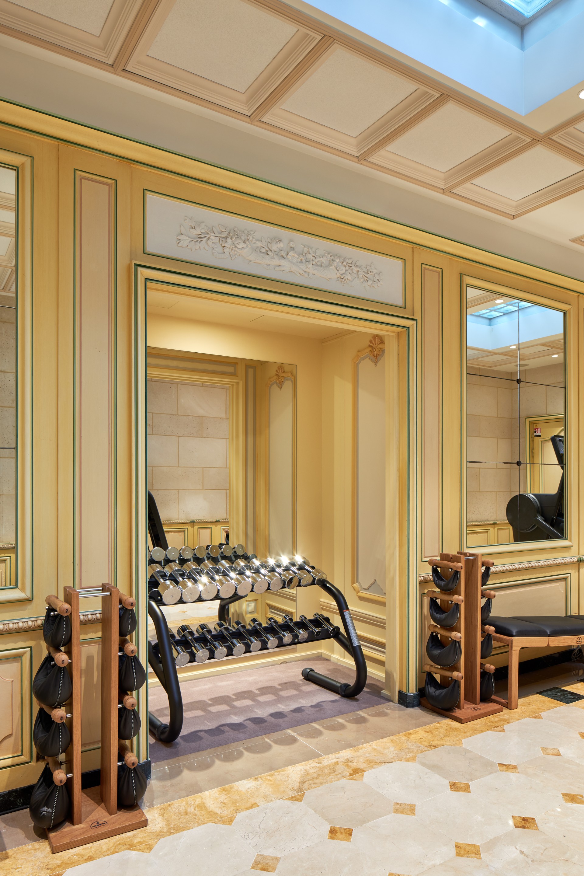 a room with a mirror and exercise equipment