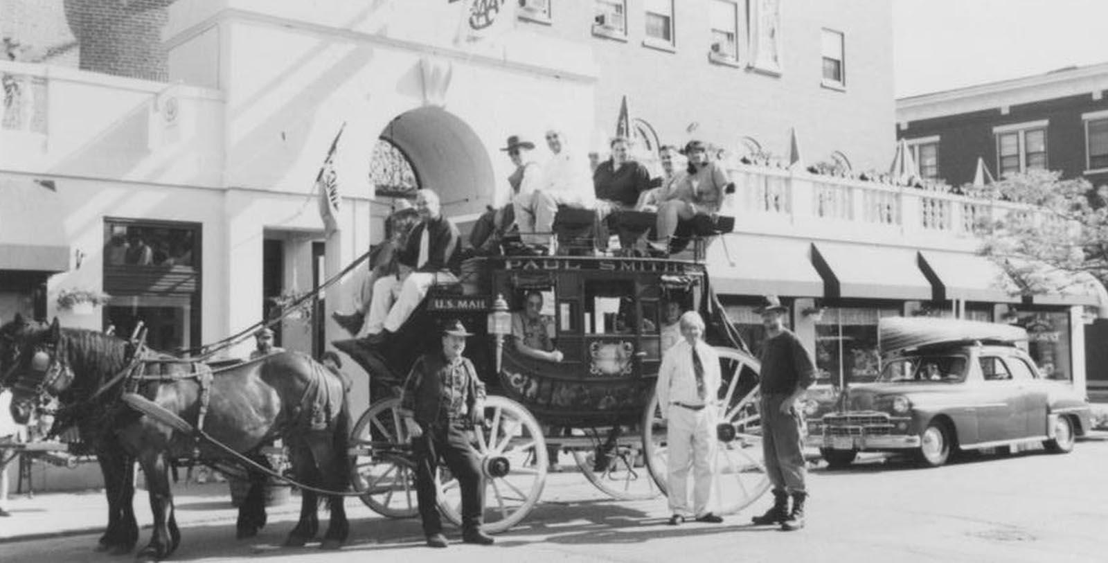 a group of people on a horse carriage