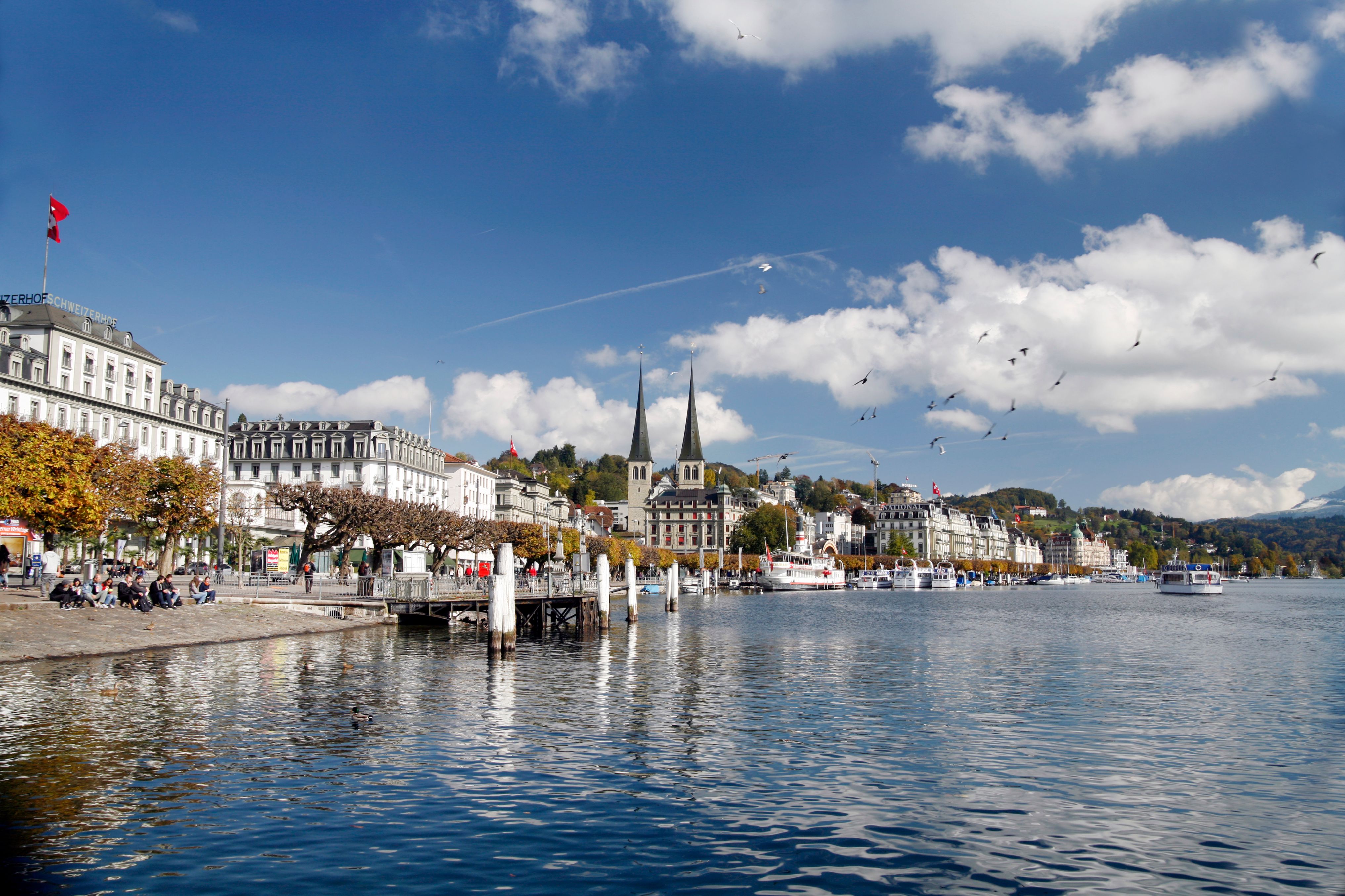 a body of water with buildings and boats on the side
