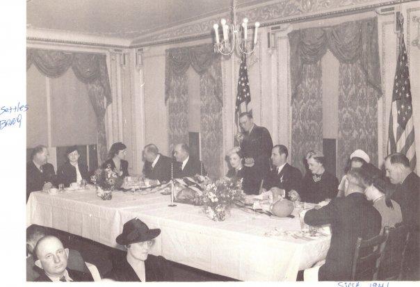 a group of people sitting at a table