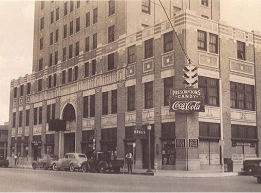 a building with a sign on the corner