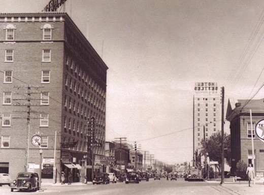 a street with cars and buildings
