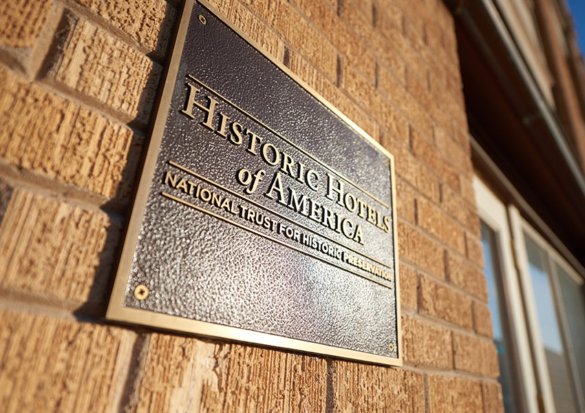 a sign on a brick wall