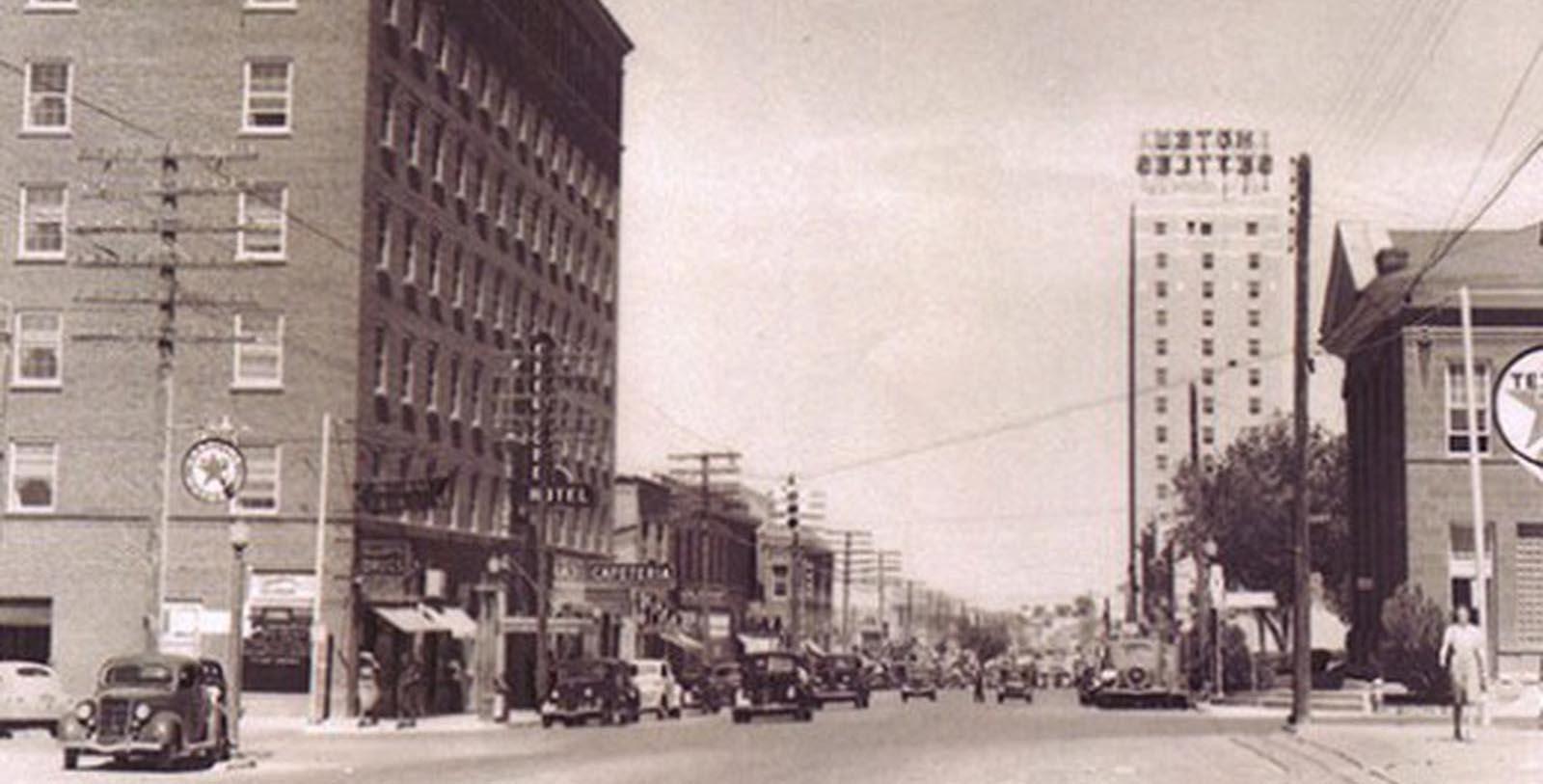 a street with cars and buildings
