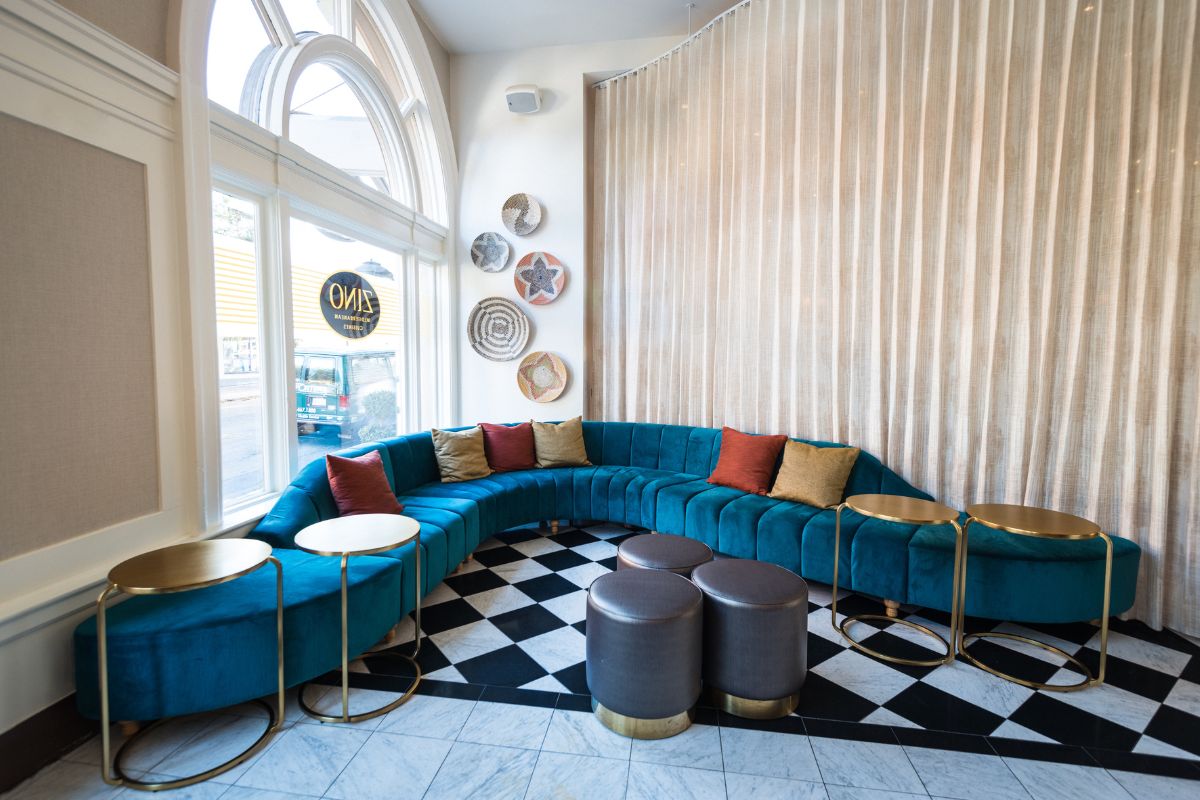 a room with a couch and tables