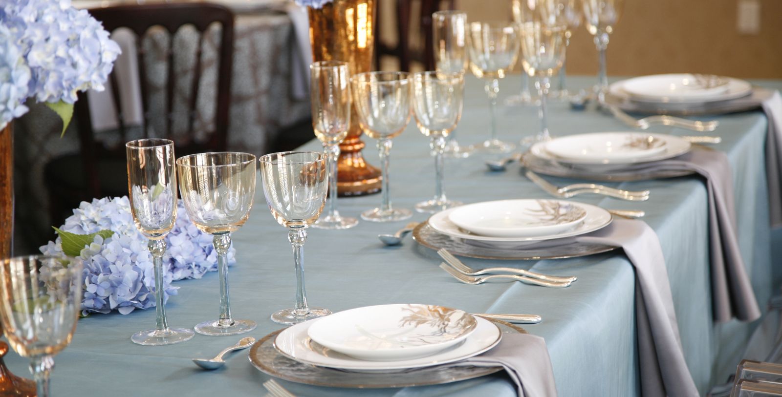 a table with plates and glasses