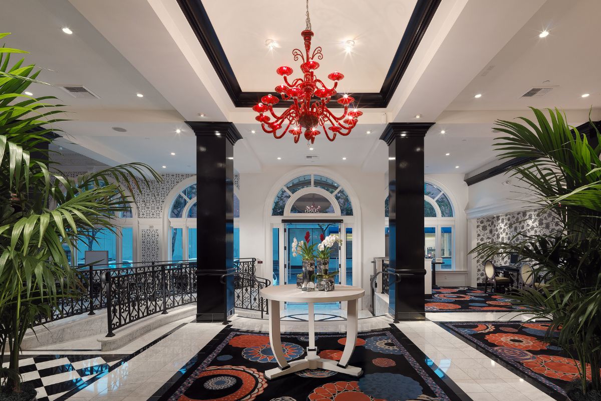 a large room with a red chandelier