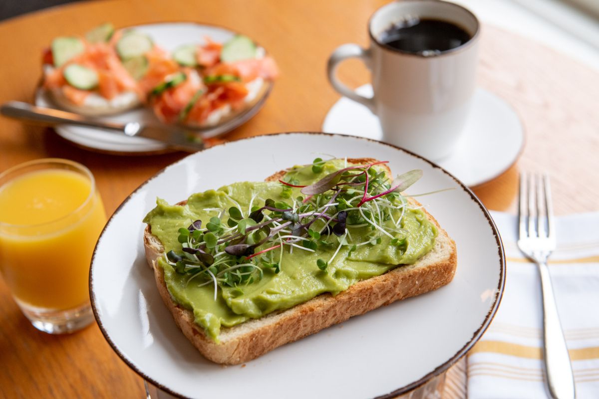a plate of food and a cup of coffee
