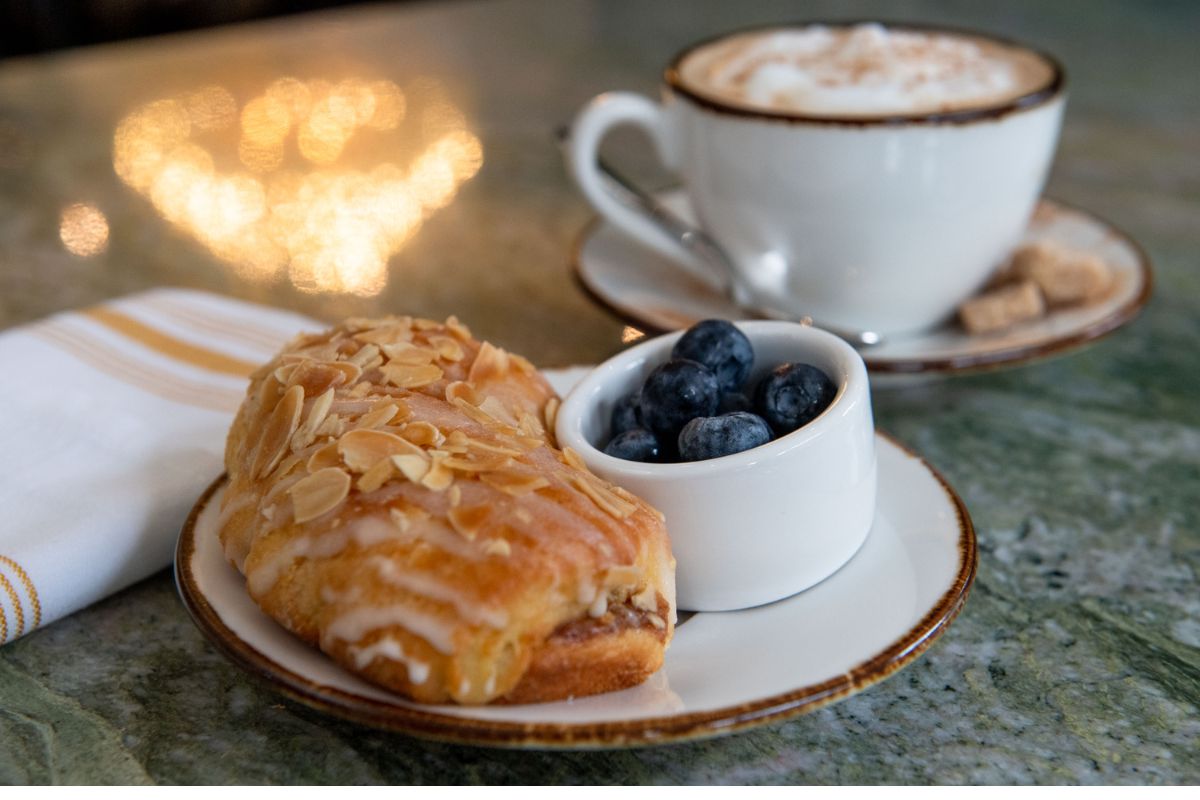 a pastry and a cup of coffee