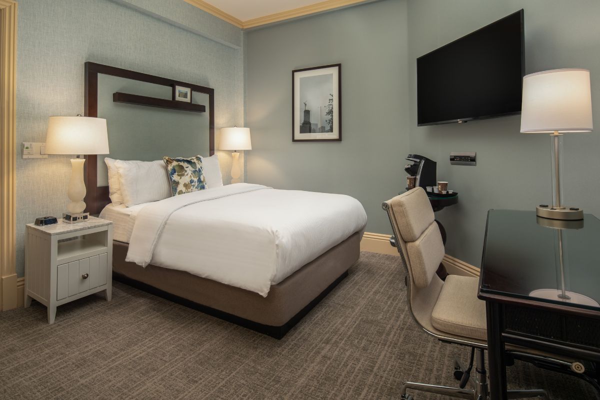a room with a bed and a desk