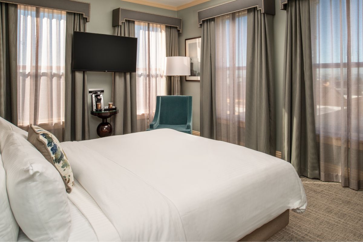 a bedroom with a bed and a tv