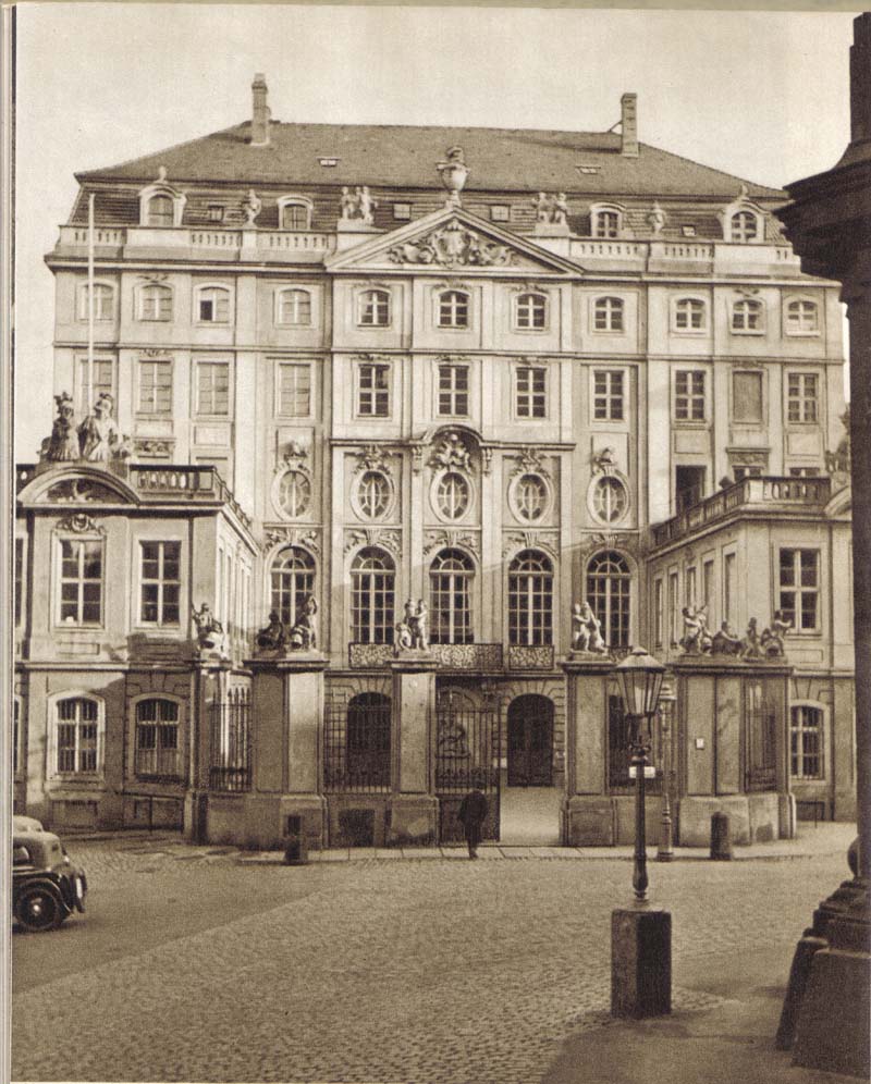 a large building with a gated entrance