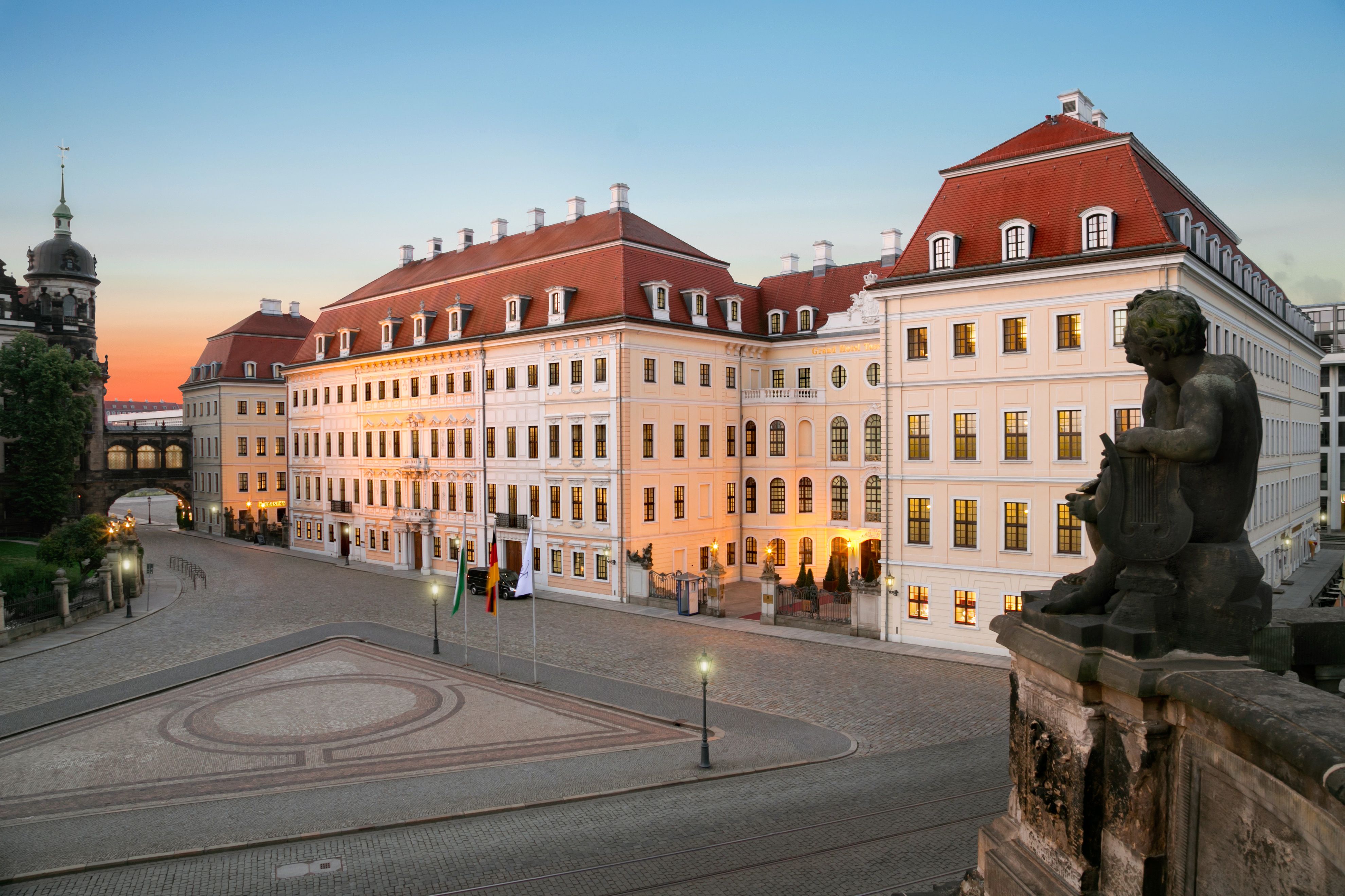 a large building with a statue in front of it