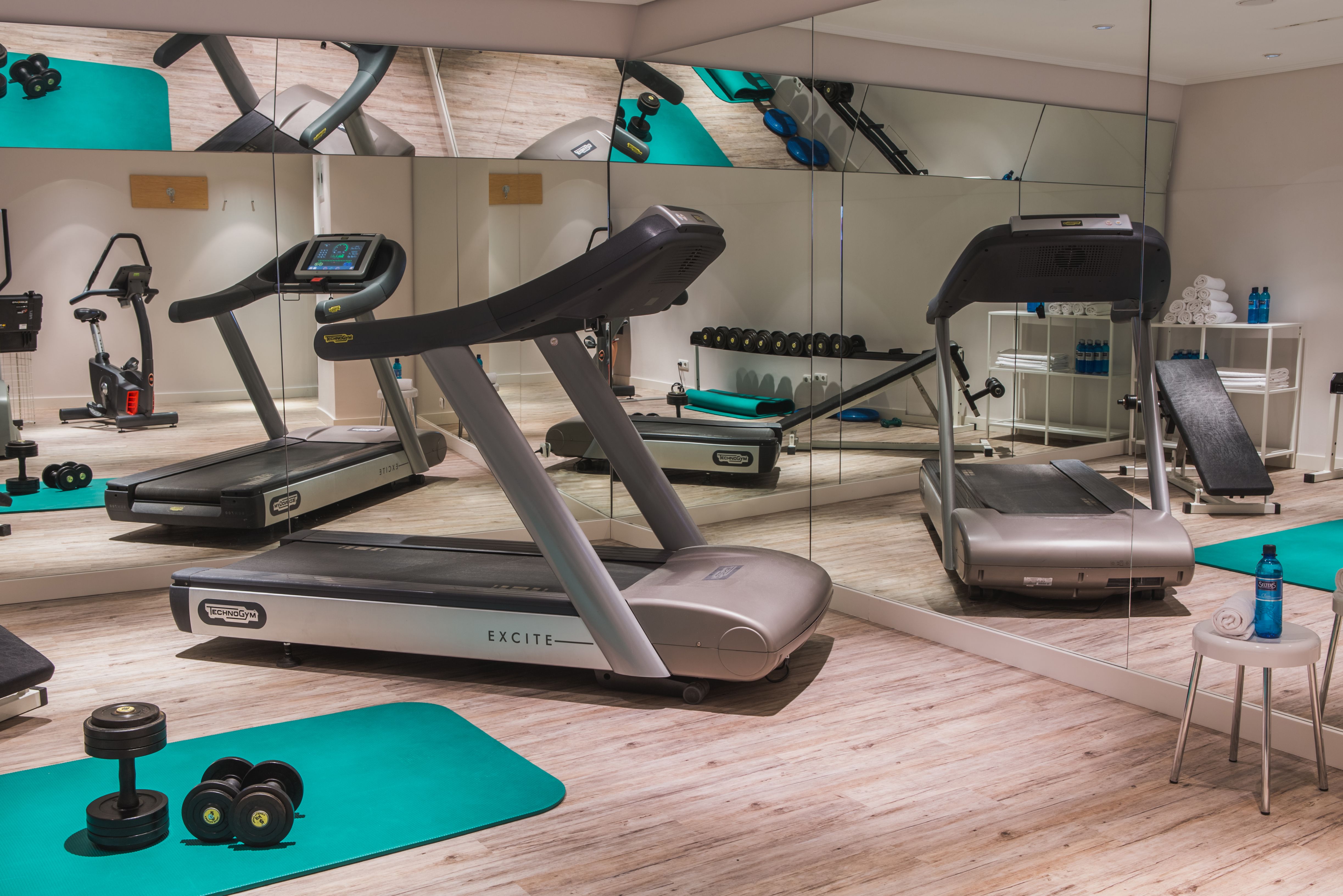 a room with treadmills and exercise equipment