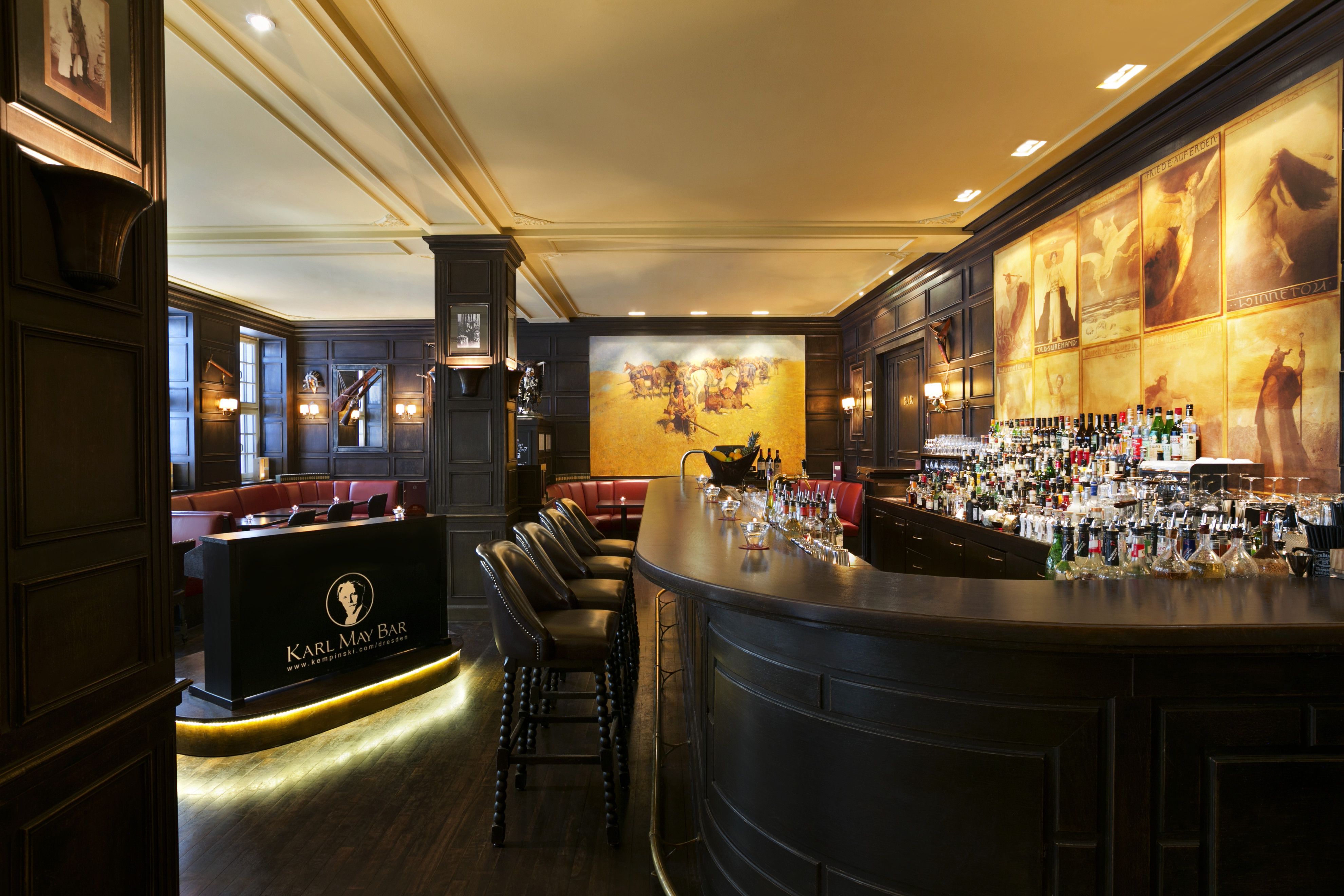 a bar with a row of bottles