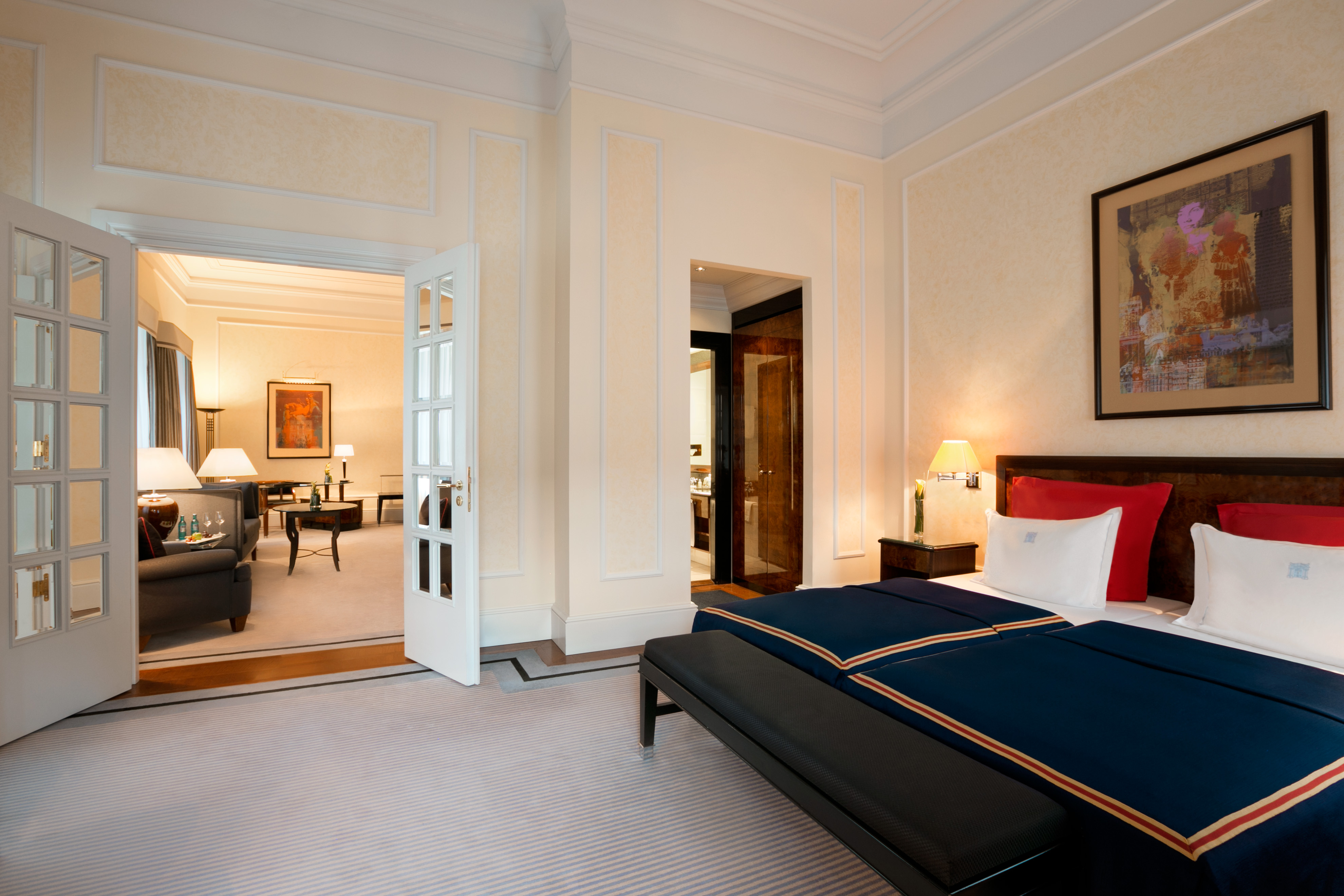 a bedroom with a bed and a couch