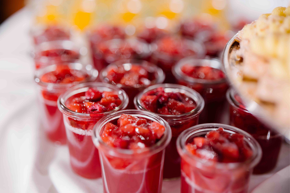 a group of small glasses of food