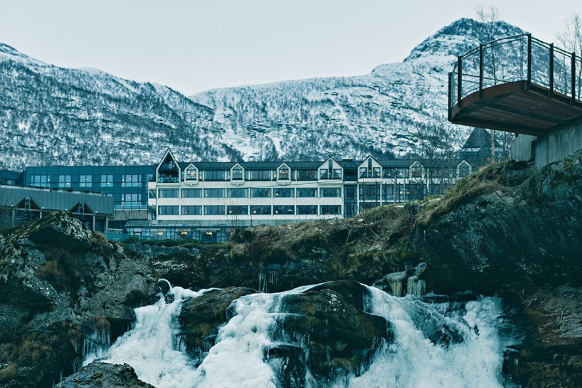 a waterfall in front of a building