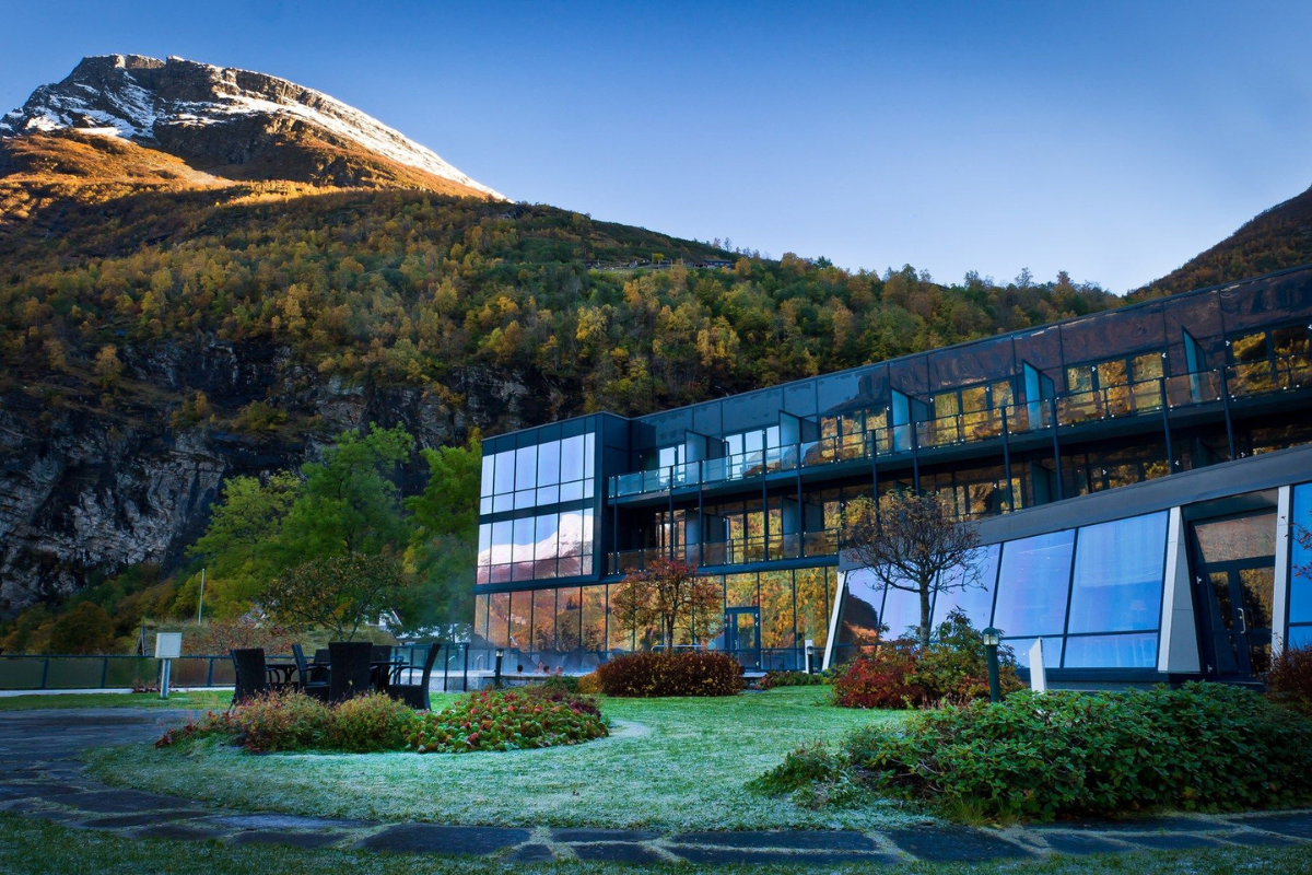 a building with a mountain in the background