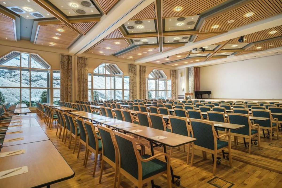 a room with many chairs and tables