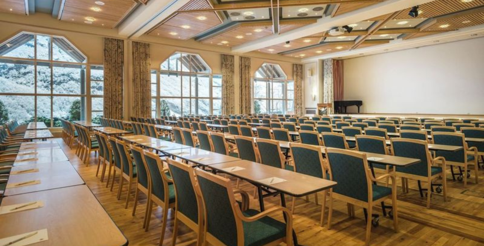 a room with many chairs and tables