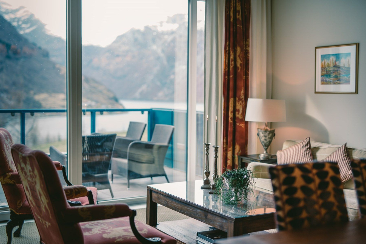 a living room with a table and chairs