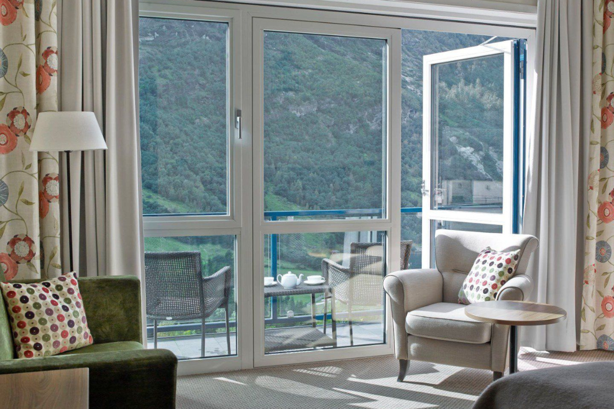 a room with a view of the mountains