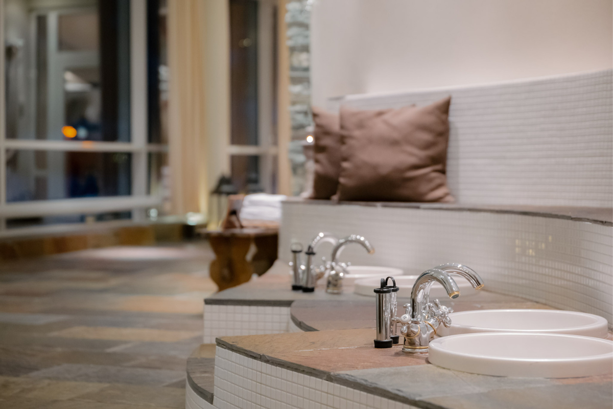 a bathroom with a sink and a bench
