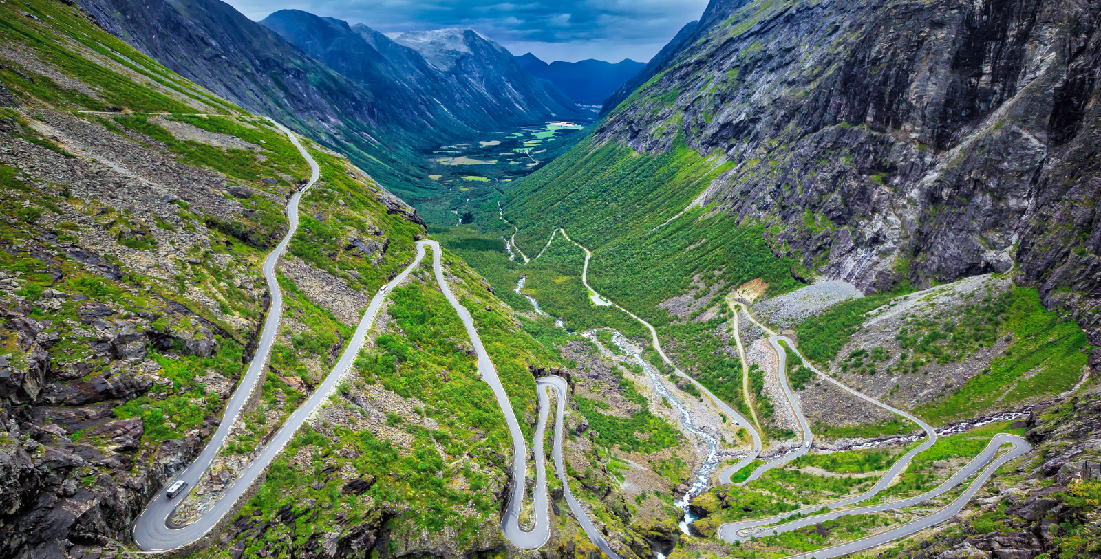 a winding road in a valley
