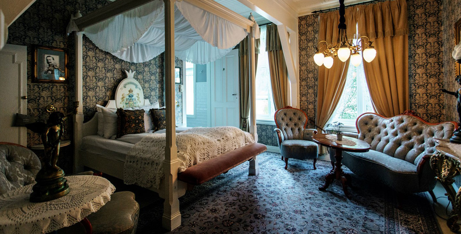 a bedroom with a canopy bed and a table